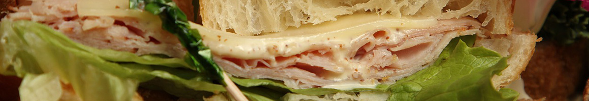 Eating Sandwich at Aroma Joe's Coffee restaurant in Lisbon, ME.
